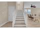 Carpeted staircase with white banister leading to the upper level at 11074 Caramel Crest Ct, Las Vegas, NV 89135