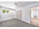 Bedroom featuring carpeted floors, large windows and a closet at 1116 E Owens Ave, North Las Vegas, NV 89030