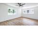 Bright, spacious bedroom featuring wood floors and large windows with outdoor views at 1116 E Owens Ave, North Las Vegas, NV 89030