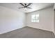 Bedroom with gray carpet and window overlooking the neighborhood at 1116 E Owens Ave, North Las Vegas, NV 89030