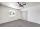 Bright bedroom features new carpet, a ceiling fan and a large window at 1116 E Owens Ave, North Las Vegas, NV 89030