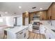 Updated kitchen featuring an island, stainless appliances, and modern finishes at 1116 E Owens Ave, North Las Vegas, NV 89030