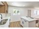 Bright kitchen with white countertops, an island, and stainless steel sink at 1116 E Owens Ave, North Las Vegas, NV 89030
