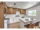 Modern kitchen with stainless steel appliances, white cabinets, and quartz countertops at 1116 E Owens Ave, North Las Vegas, NV 89030