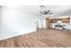 Open living room showcases wood floors and seamless transition to the kitchen at 1116 E Owens Ave, North Las Vegas, NV 89030