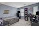Stylish bedroom with a desk setup, creating a functional and inviting atmosphere for both sleep and study at 12107 Frost Lime Rd # 1, Las Vegas, NV 89183