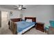 Bedroom with ceiling fan, carpet, natural light, and wood furniture at 12107 Frost Lime Rd # 1, Las Vegas, NV 89183