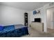 Relaxing bedroom with gray and blue accents, a comfortable bed, sleek dresser, and ample room for personalization at 12107 Frost Lime Rd # 1, Las Vegas, NV 89183