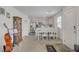 Bright dining area with a decorative wood table, white chairs and an open floor plan to the kitchen at 12107 Frost Lime Rd # 1, Las Vegas, NV 89183