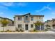 Charming two-story home featuring stylish stucco and gray accents, and a well-maintained landscaped yard at 12107 Frost Lime Rd # 1, Las Vegas, NV 89183