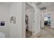 Bright hallway featuring an open closet space and doorways leading to bedrooms, offering easy access and convenient storage at 12107 Frost Lime Rd # 1, Las Vegas, NV 89183