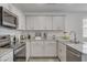 Bright kitchen with stainless steel appliances, granite countertops, and ample cabinet space at 12107 Frost Lime Rd # 1, Las Vegas, NV 89183