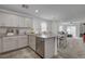 Bright kitchen with stainless steel appliances, granite countertops, and an open floor plan at 12107 Frost Lime Rd # 1, Las Vegas, NV 89183