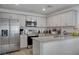 Modern kitchen with stainless steel appliances, granite countertops, and ample cabinet space at 12107 Frost Lime Rd # 1, Las Vegas, NV 89183