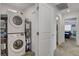 Laundry room area with stacked washer and dryer near bedrooms at 12107 Frost Lime Rd # 1, Las Vegas, NV 89183