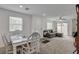 Cozy living room featuring a comfortable sofa, dining area and plenty of natural light at 12107 Frost Lime Rd # 1, Las Vegas, NV 89183