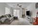 Modern living room with neutral decor, carpeted floors, and easy access to the backyard through a sliding door at 12107 Frost Lime Rd # 1, Las Vegas, NV 89183
