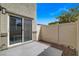 Cozy outdoor patio with sliding glass door for easy indoor/outdoor living and privacy fence at 12107 Frost Lime Rd # 1, Las Vegas, NV 89183