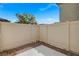 Enclosed patio with neutral privacy fencing, rock cover and a concrete pad for seating or grilling at 12107 Frost Lime Rd # 1, Las Vegas, NV 89183
