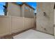 Private outdoor patio with concrete flooring, block wall, and access to home via sliding glass door at 12107 Frost Lime Rd # 1, Las Vegas, NV 89183