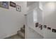 Carpeted stairway with white walls and framed Gathering photos creates a warm and inviting transition between floors at 12107 Frost Lime Rd # 1, Las Vegas, NV 89183
