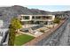 Luxury home with an infinity pool, modern patio furniture, and stunning views at 13 Rockstream Dr, Henderson, NV 89012