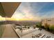 Gorgeous sunset view overlooking an infinity pool and lounge area, highlighting the luxurious outdoor living space at 13 Rockstream Dr, Henderson, NV 89012