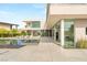 Modern home featuring an infinity pool, sleek patio, desert landscaping, and ample space for entertaining at 13 Rockstream Dr, Henderson, NV 89012
