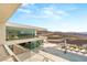 Luxury home featuring an infinity pool, outdoor lounge areas, and panoramic mountain views at 13 Rockstream Dr, Henderson, NV 89012
