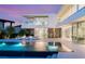 Modern two-story home with a pool and stunning architectural features for outdoor entertainment at 13 Rockstream Dr, Henderson, NV 89012