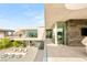 Modern backyard with outdoor lounge areas, sleek fire features, and stunning architectural design at 13 Rockstream Dr, Henderson, NV 89012