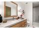 Stylish bathroom featuring a wood vanity with a vessel sink and a modern design at 13 Rockstream Dr, Henderson, NV 89012