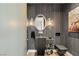 A modern powder room features a stylish black sink and a sleek, minimalist design at 13 Rockstream Dr, Henderson, NV 89012