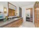 Elegant bathroom featuring a vanity with built-in storage and a separate makeup area at 13 Rockstream Dr, Henderson, NV 89012