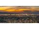 Panoramic view of city lights at dusk from a high vantage point, showcasing a vibrant skyline at 13 Rockstream Dr, Henderson, NV 89012