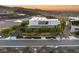 Contemporary home exterior with desert landscaping, a private driveway, and an upper level patio at 13 Rockstream Dr, Henderson, NV 89012