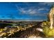 Elevated view of modern home with city lights in the background during twilight hours at 13 Rockstream Dr, Henderson, NV 89012