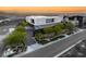 Modern home exterior with clean lines, manicured landscaping, and a private driveway in monochrome at 13 Rockstream Dr, Henderson, NV 89012
