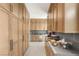 Spacious butler's pantry area offering generous cabinet space, modern appliances, and a functional design at 13 Rockstream Dr, Henderson, NV 89012