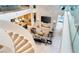 Open living room with fireplace and view of the kitchen from the top of the spiral staircase at 13 Rockstream Dr, Henderson, NV 89012