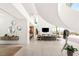 Bright, open-concept living room with a fireplace, modern decor, and city views at 13 Rockstream Dr, Henderson, NV 89012