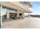 Bright living space with fireplace flowing onto an outdoor patio with views and a modern kitchen at 13 Rockstream Dr, Henderson, NV 89012