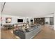 Spacious living room featuring a bar area, lounge, and games at 13 Rockstream Dr, Henderson, NV 89012