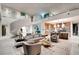 Bright, spacious open-concept layout showcasing spiral staircase, modern kitchen, and stylish living space at 13 Rockstream Dr, Henderson, NV 89012