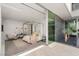 Bright bedroom with minimalist decor, canopy bed, and access to private courtyard at 13 Rockstream Dr, Henderson, NV 89012