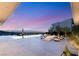 Luxury outdoor space featuring a fire pit, lounge seating, and a pool with cityscape views at 13 Rockstream Dr, Henderson, NV 89012