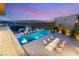Elevated infinity pool and lounge area offering spectacular views of the city skyline at 13 Rockstream Dr, Henderson, NV 89012