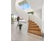Modern spiral staircase featuring wood steps and sleek white railing at 13 Rockstream Dr, Henderson, NV 89012