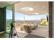 Outdoor terrace featuring comfortable seating, a telescope for stargazing, and panoramic city views at 13 Rockstream Dr, Henderson, NV 89012