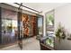 Elegant wine cellar with extensive storage, climate control, and stylish glass doors, ideal for wine enthusiasts at 13 Rockstream Dr, Henderson, NV 89012